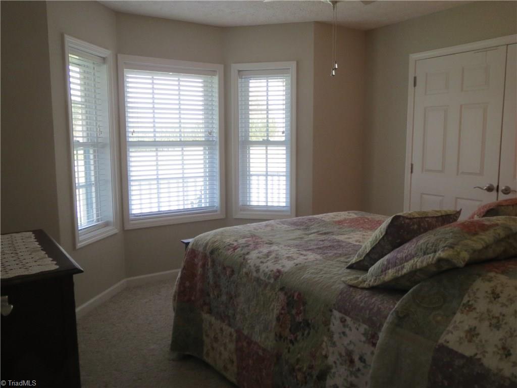2212 Little Elkin Church Road Ronda, NC 28670 - Photo 21 of 30 Second bedroom features charming bay window and large closet.