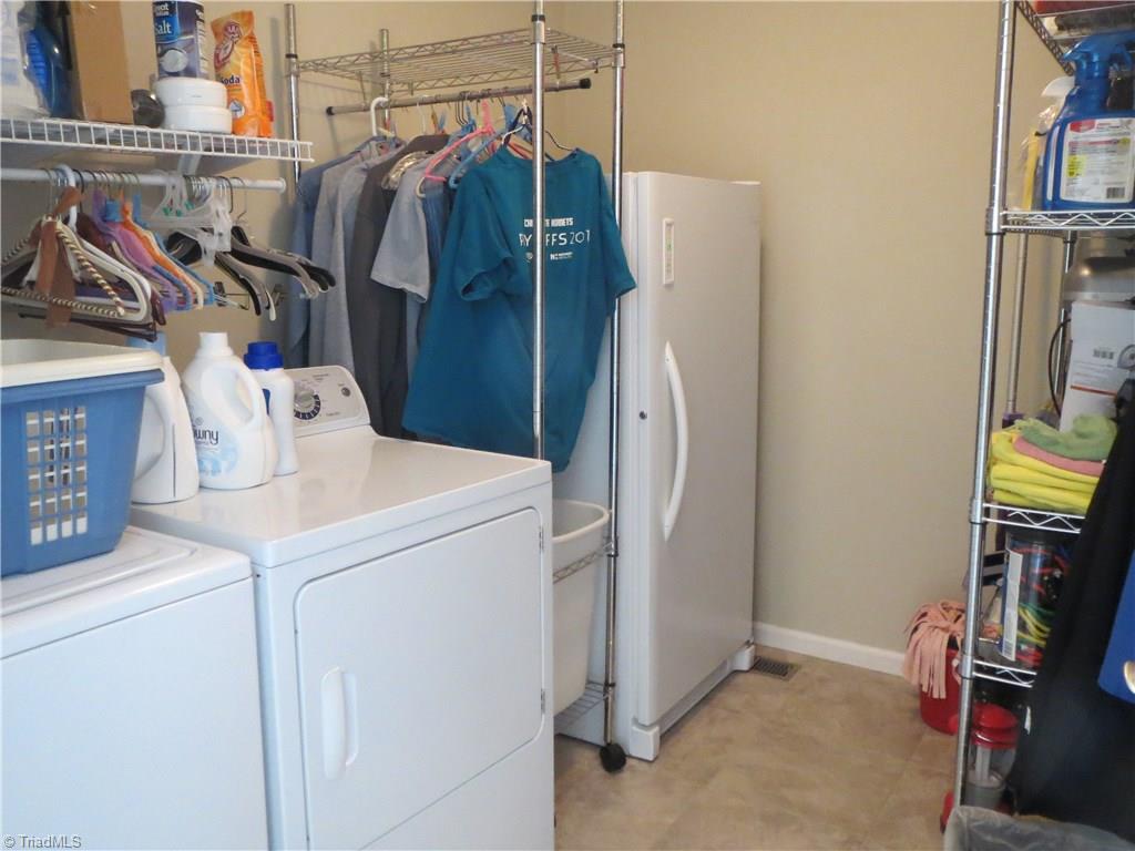 2212 Little Elkin Church Road Ronda, NC 28670 - Photo 25 of 30 The laundry room is conveniently located on the main level and provides ample storage space.