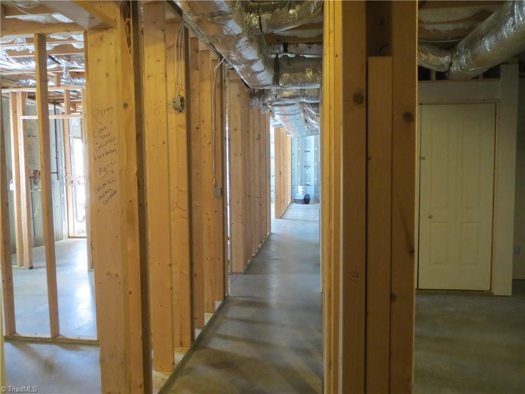 2212 Little Elkin Church Road Ronda, NC 28670 - Photo 26 of 30 What a basement! Ready to be finished with dry wall, this basement is cooled and heated by separate heat pump, is already wired for electric and is plumbed for a third bath.