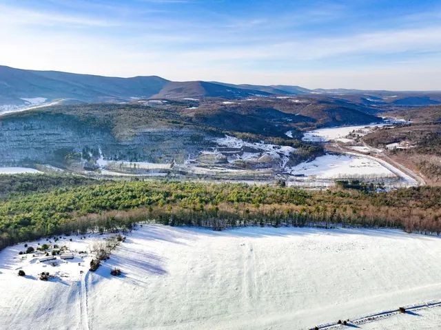 an aerial view of houses with yard