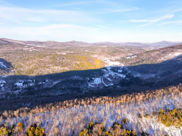 a view of lake and mountain