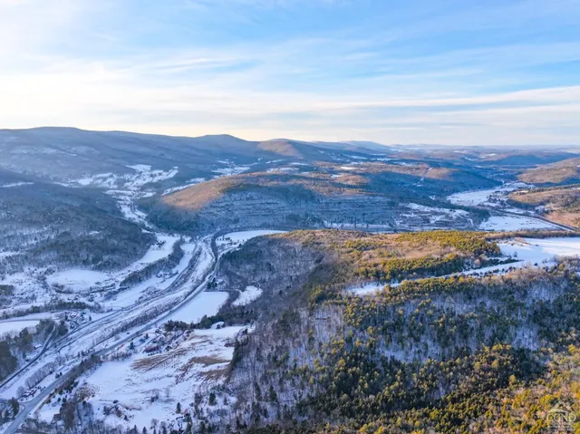 an aerial view of residential house with parking space