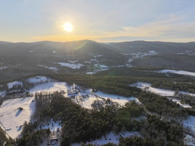 a view of a large mountains in a field