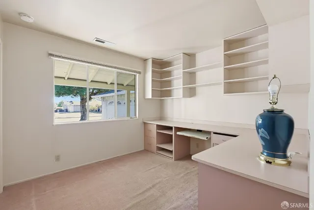 a room with furniture and window