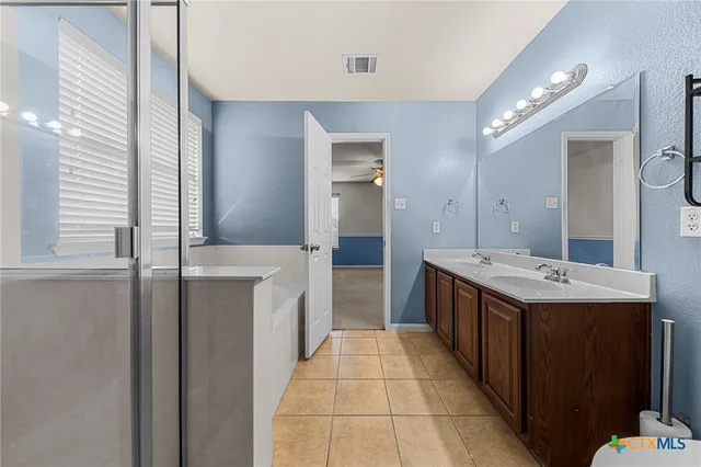 a kitchen with a sink and a refrigerator