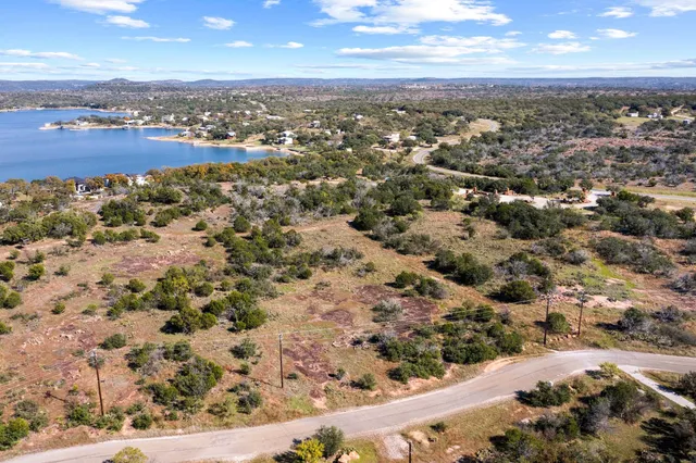 an aerial view of a house with a lake view