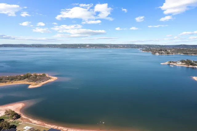 a view of a room with workspace and a window