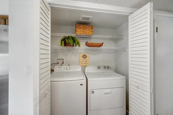 a utility room with dryer and washer