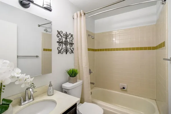 an empty room with a chandelier fan