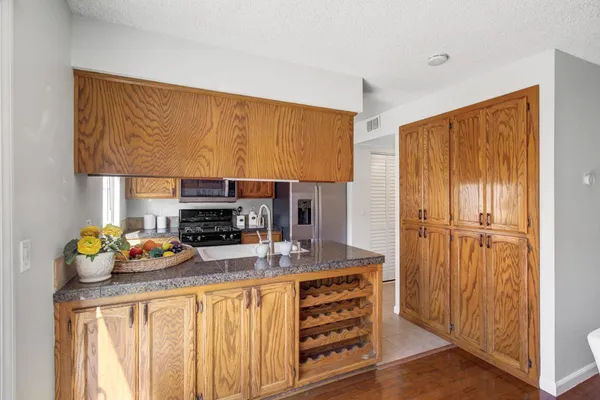 a kitchen that has a cabinets and window