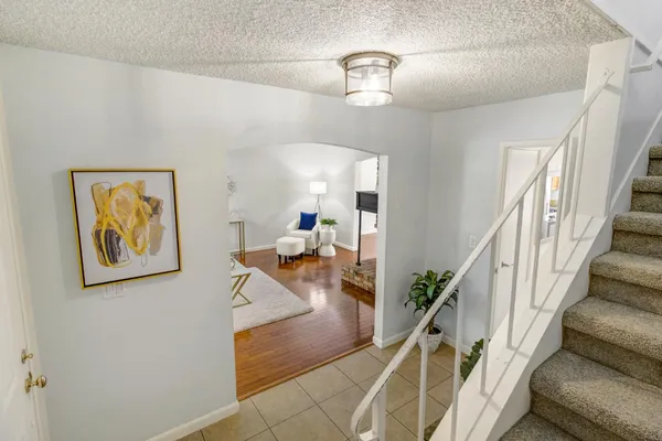 a lobby with furniture and flowers