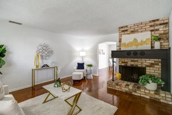 a house view with a potted plant in front of it