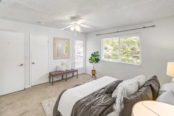 a bed room with a bed and a chandelier