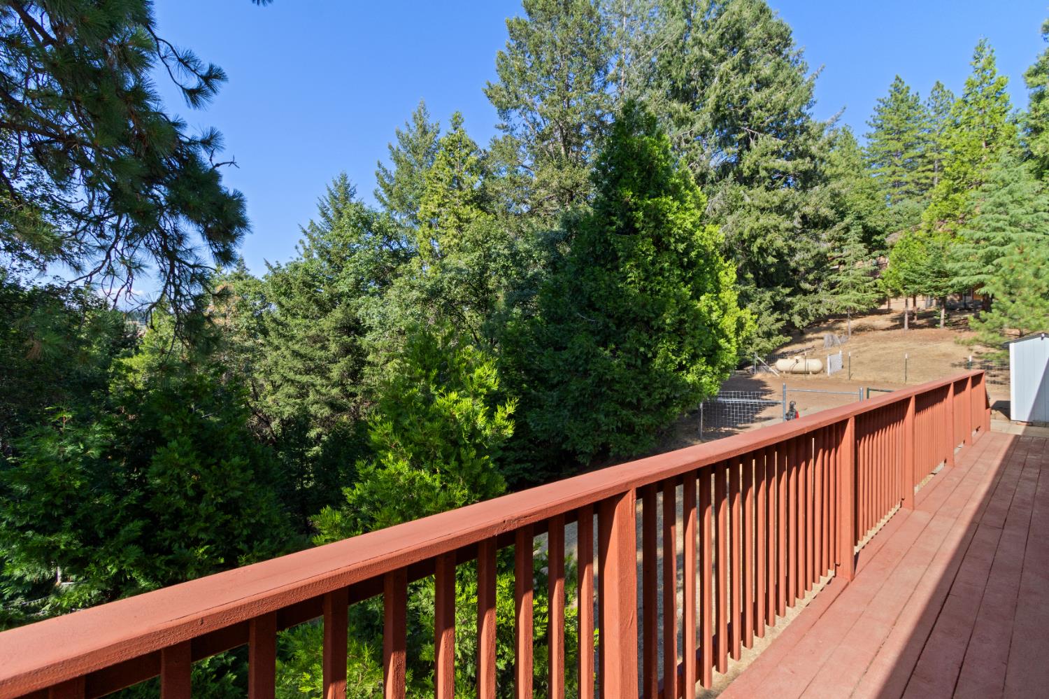 5341 Puerta Del Sol Road Camino, CA 95709 - Photo 31 of 31 a view of a balcony with wooden floor and fence
