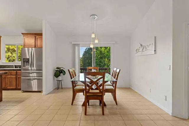 a dining room with furniture and window