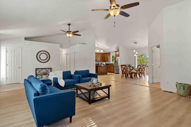 a living room with furniture and a clock