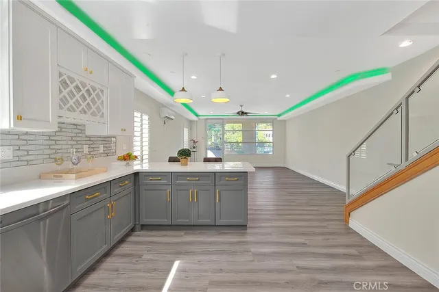 a view of a kitchen from a hallway