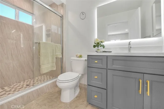 a bedroom with a bed and a lamp