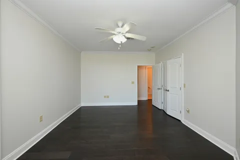a bathroom with a granite countertop sink a toilet and a mirror