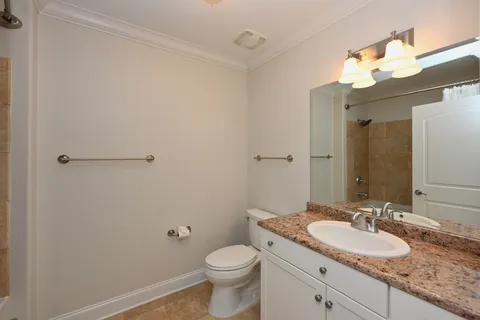 a room that has a bed and a table in it