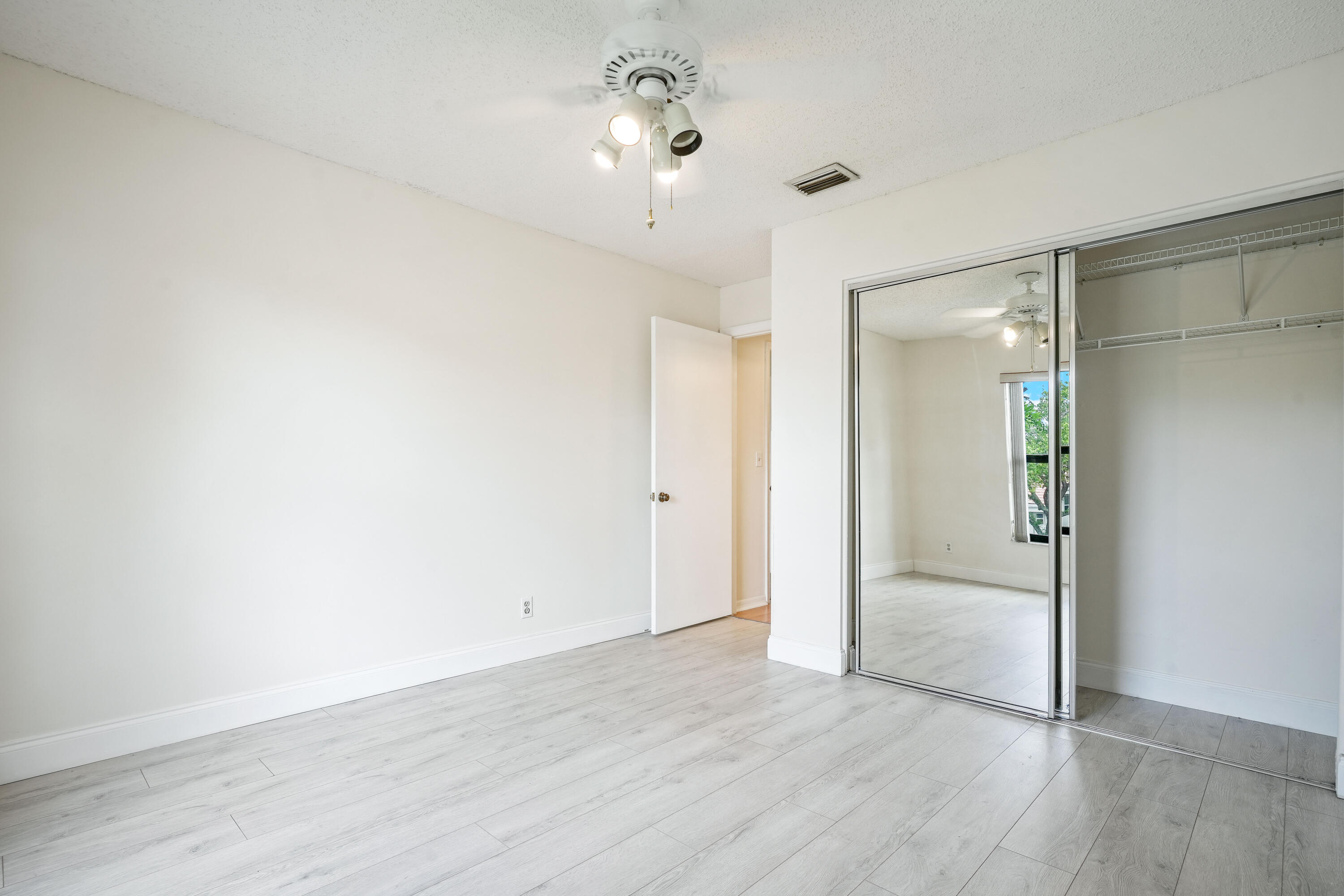 10910 Lakemore Lane, Unit 201 Boca Raton, FL 33498 - Photo 25 of 67 wooden floor in an empty room