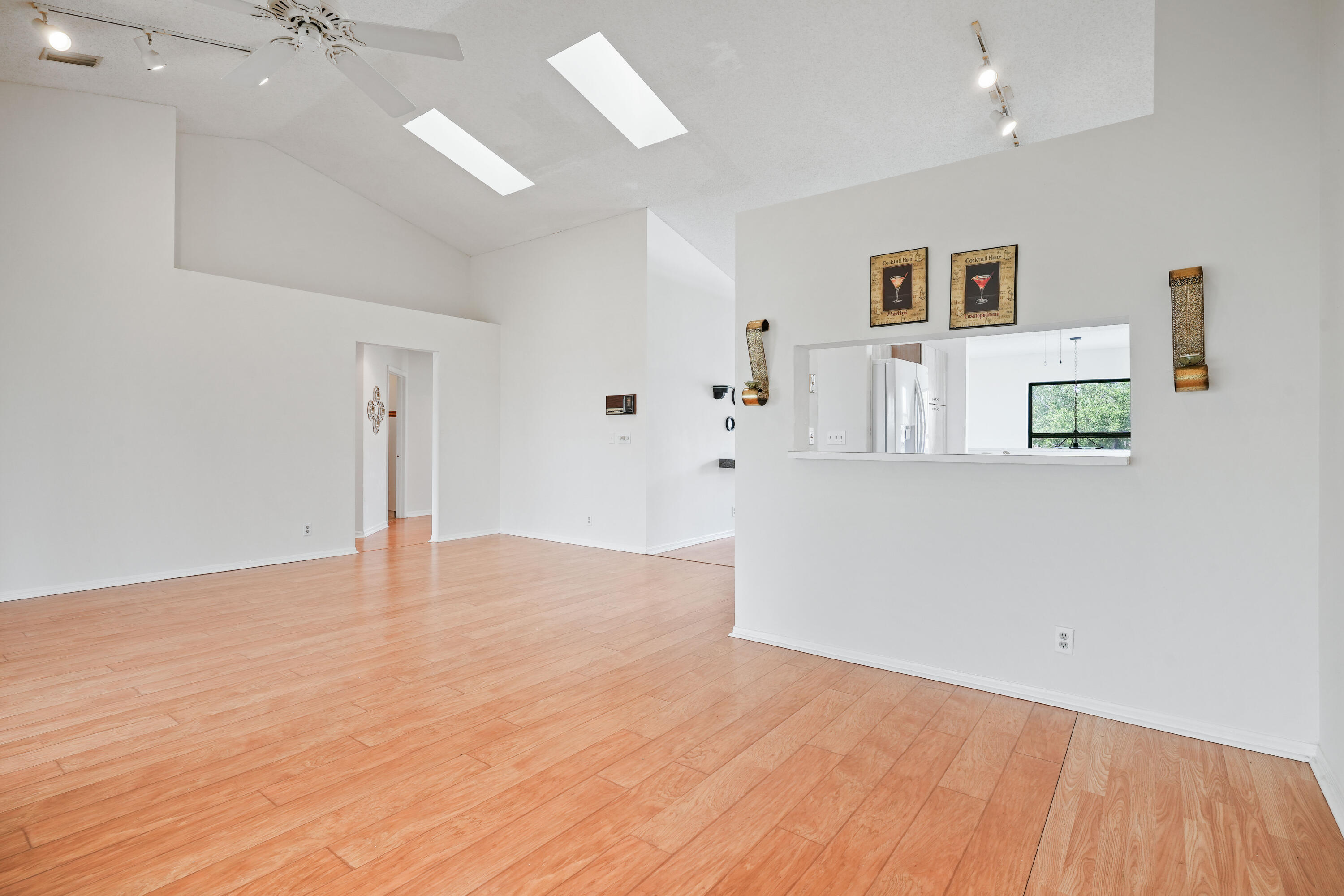 10910 Lakemore Lane, Unit 201 Boca Raton, FL 33498 - Photo 10 of 67 a view of an empty room with a window