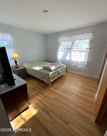 a bedroom with furniture and a window
