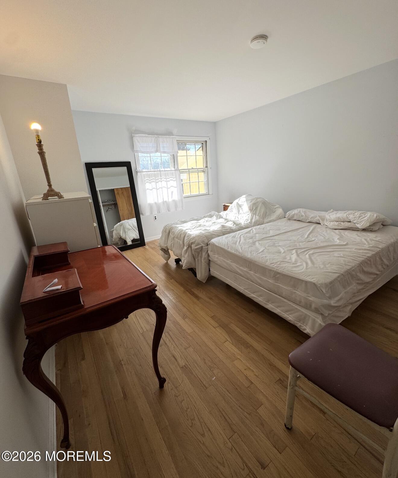 33 Parker Road West Long Branch, NJ 07764 - Photo 13 of 13 a bedroom with a bed window and mirror