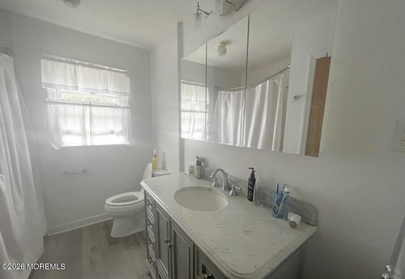 33 Parker Road West Long Branch, NJ 07764 - Photo 10 of 13 a bathroom with a sink toilet and window