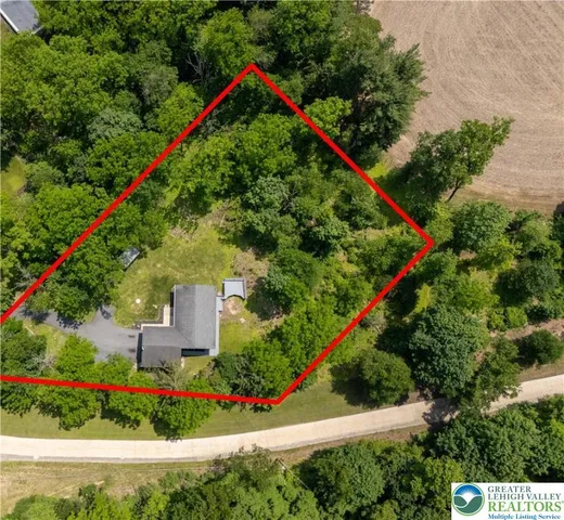 an aerial view of a house with a garden