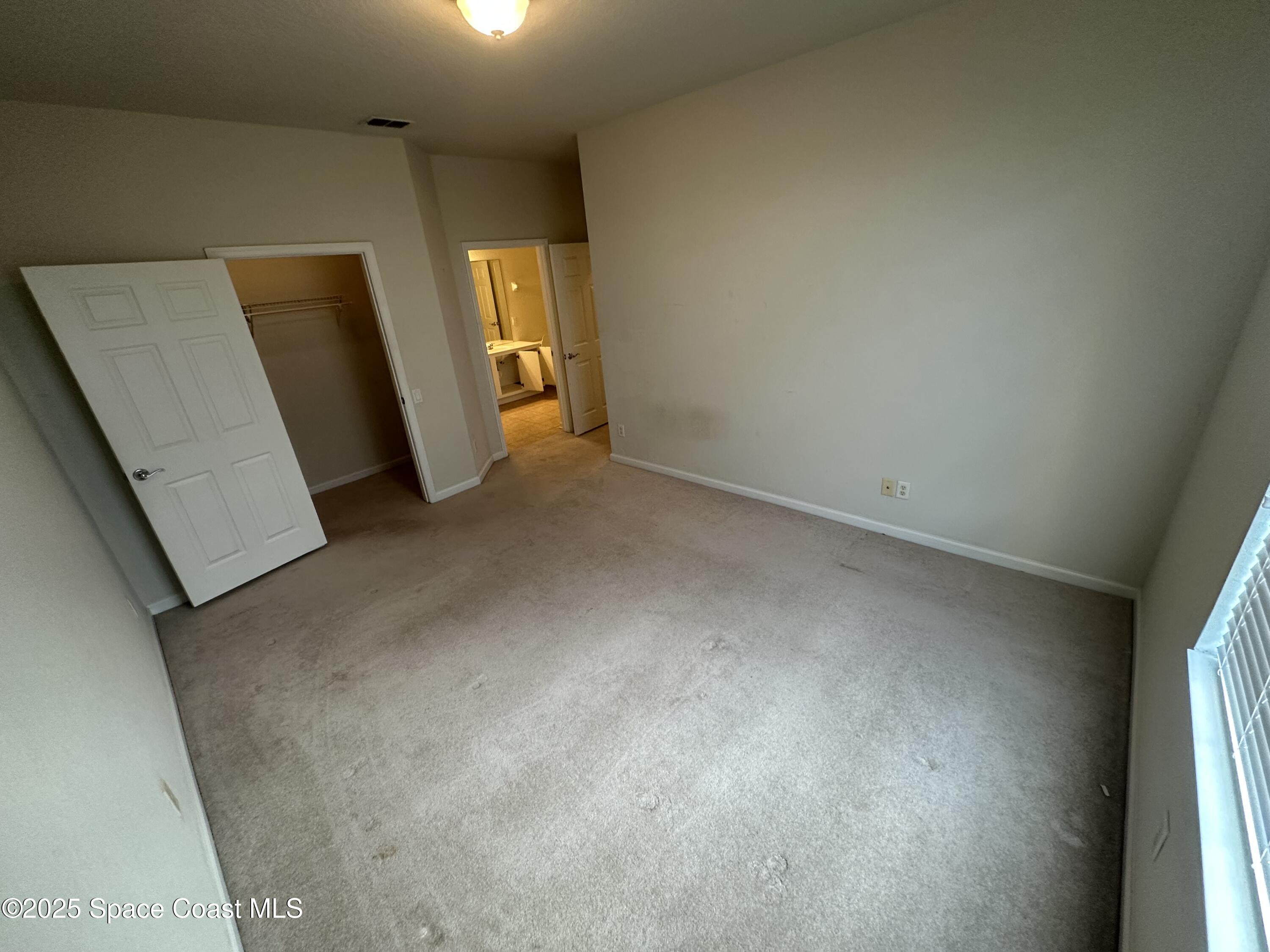 1626 Peregrine Circle, Unit 305 Rockledge, FL 32955 - Photo 14 of 20 a view of a room with a closet