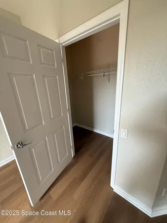 view of a room with wooden floor