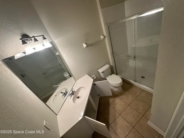 a bathroom with a sink and toilet