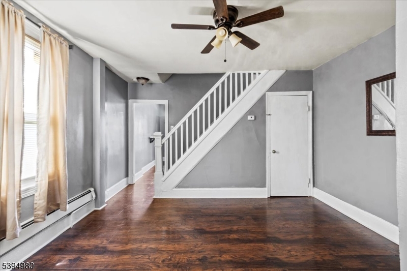 636 Elizabeth Street Beverly, NJ 08010 - Photo 15 of 15 a view of hallway with wooden floor and stairs