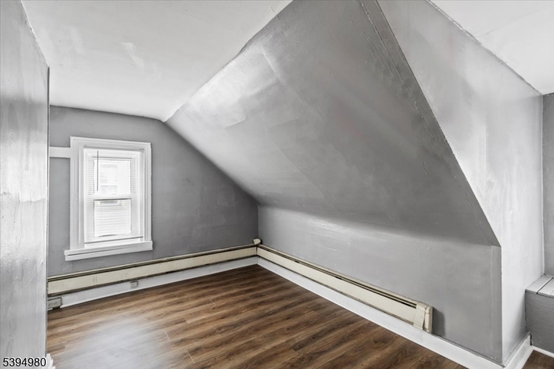 636 Elizabeth Street Beverly, NJ 08010 - Photo 8 of 15 an empty room with wooden floor and windows