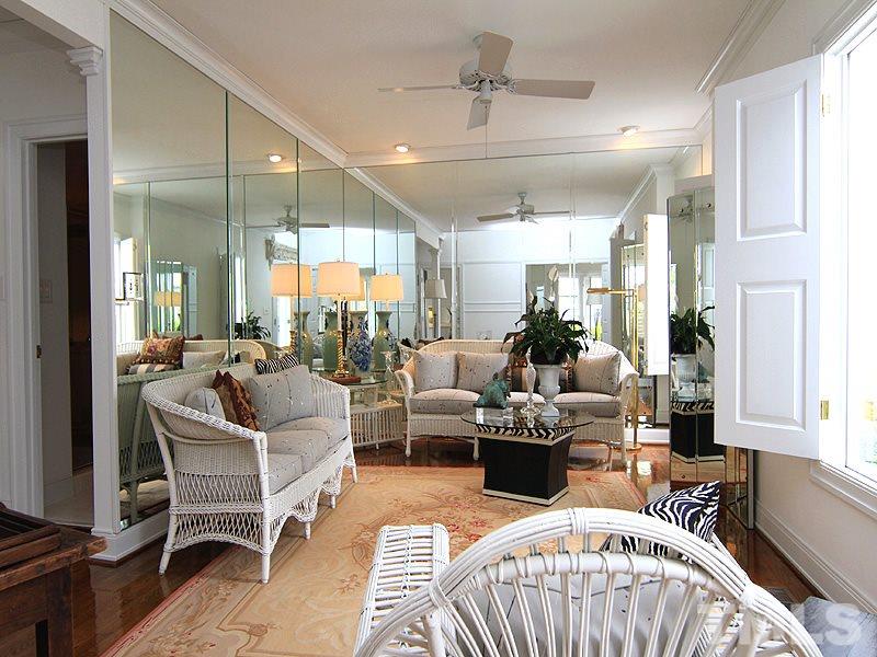 6906 Hunters Way Raleigh, NC 27615 - Photo 12 of 25 a living room with furniture wooden floor and a chandelier