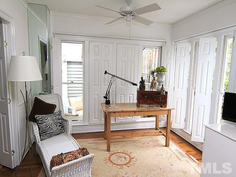 6906 Hunters Way Raleigh, NC 27615 - Photo 13 of 25 a living room with furniture and wooden floor
