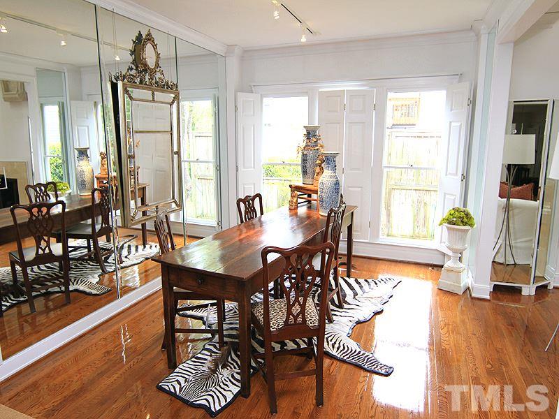 6906 Hunters Way Raleigh, NC 27615 - Photo 15 of 25 a view of a dining room with furniture window and wooden floor