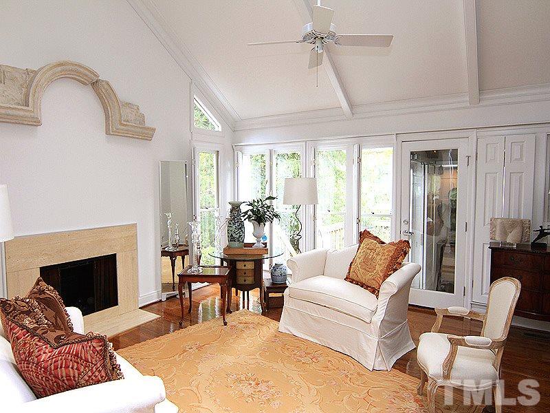 6906 Hunters Way Raleigh, NC 27615 - Photo 16 of 25 a living room with furniture fireplace and window