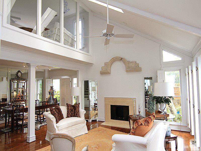 6906 Hunters Way Raleigh, NC 27615 - Photo 17 of 25 a living room with furniture fireplace and a chandelier