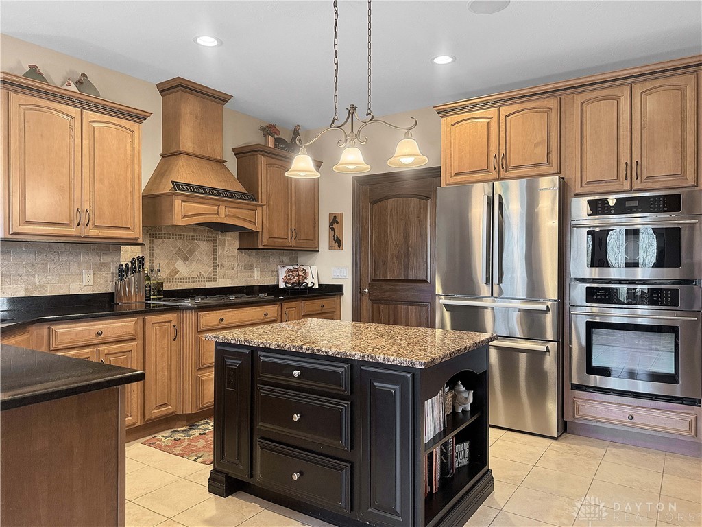 4096 Middle Urbana Road Urbana, OH 43078 - Photo 18 of 96 This kitchen offers ample storage and modern amenities, ideal for culinary pursuits and entertaining.