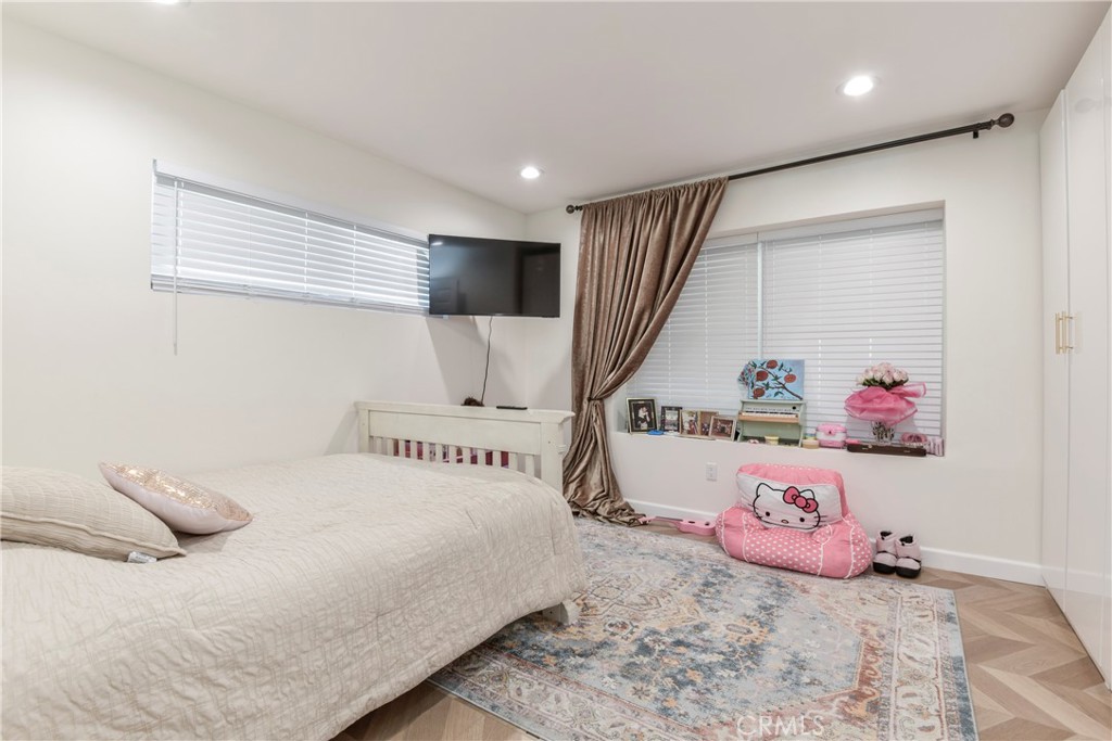 9728 Rhea Avenue Northridge, CA 91324 - Photo 22 of 36 a bedroom with a bed and a window