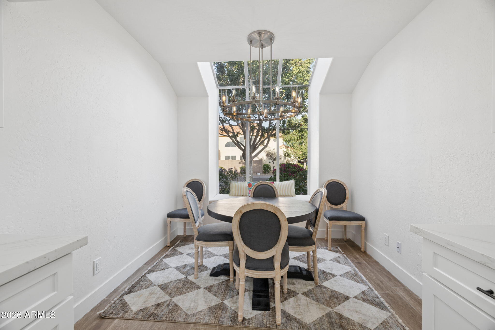16409 South 33rd Street Phoenix, AZ 85048 - Photo 12 of 61 a view of a dining room with furniture and chandelier