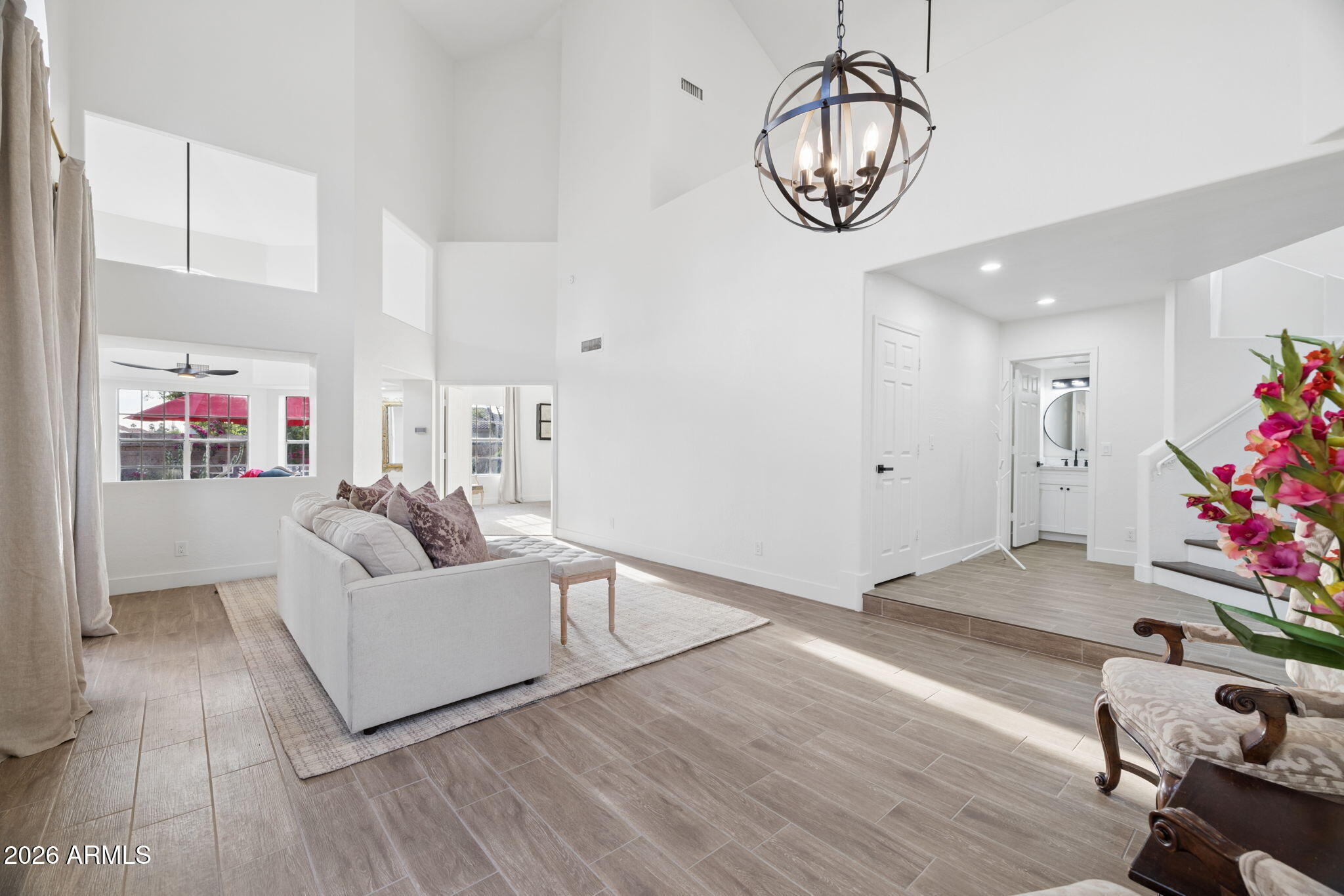 16409 South 33rd Street Phoenix, AZ 85048 - Photo 15 of 61 a living room with furniture and a chandelier
