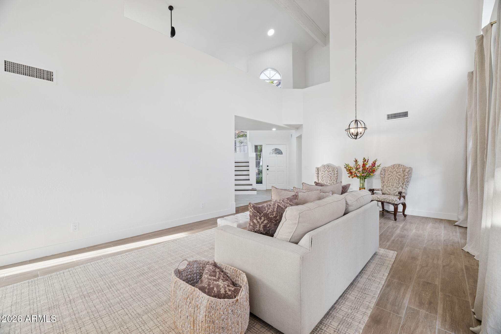 16409 South 33rd Street Phoenix, AZ 85048 - Photo 16 of 61 a living room with furniture and a wooden floor