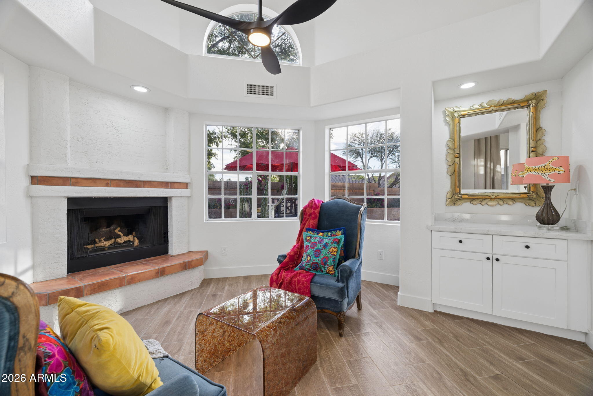16409 South 33rd Street Phoenix, AZ 85048 - Photo 19 of 61 a living room with furniture a fireplace and a chandelier