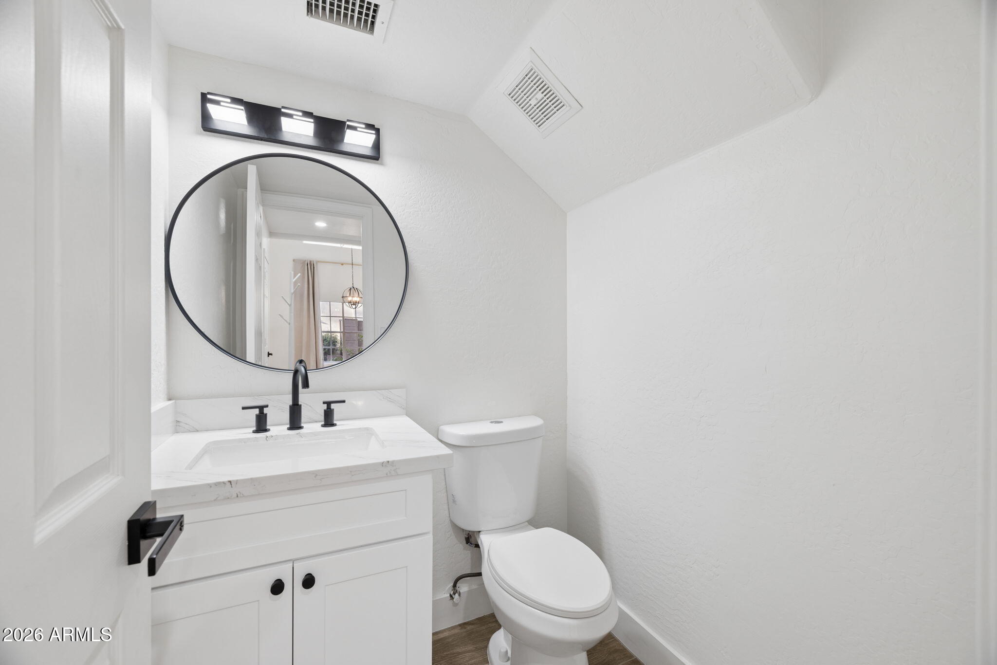 16409 South 33rd Street Phoenix, AZ 85048 - Photo 21 of 61 a bathroom with a toilet sink and mirror