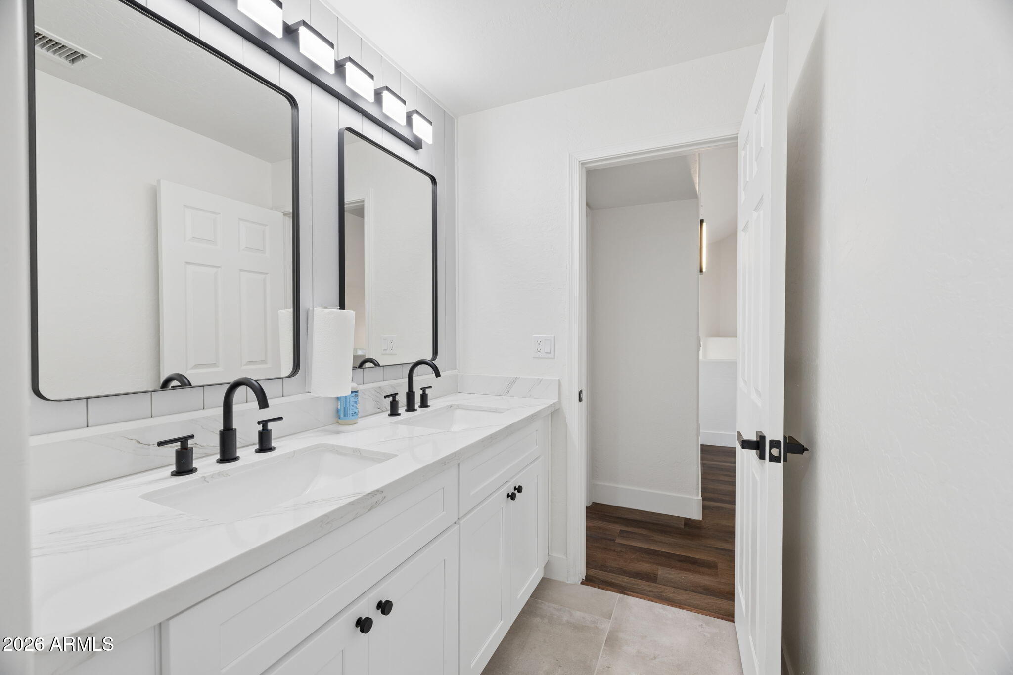 16409 South 33rd Street Phoenix, AZ 85048 - Photo 43 of 61 a bathroom with a double vanity sink and mirror