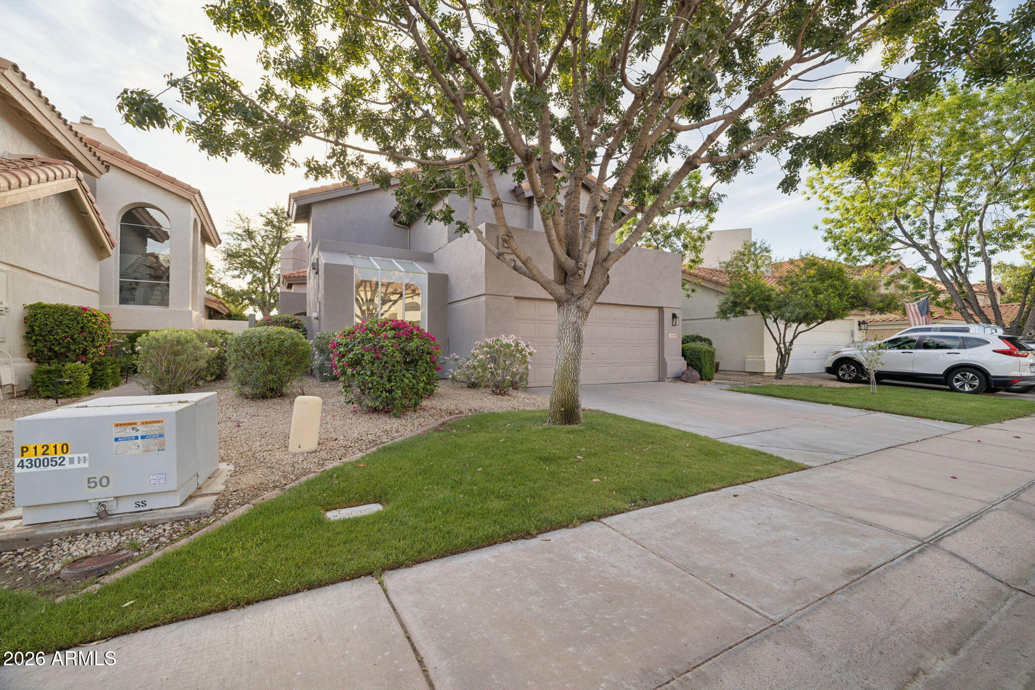 16409 South 33rd Street Phoenix, AZ 85048 - Photo 3 of 61 a front view of a house with a yard and garage