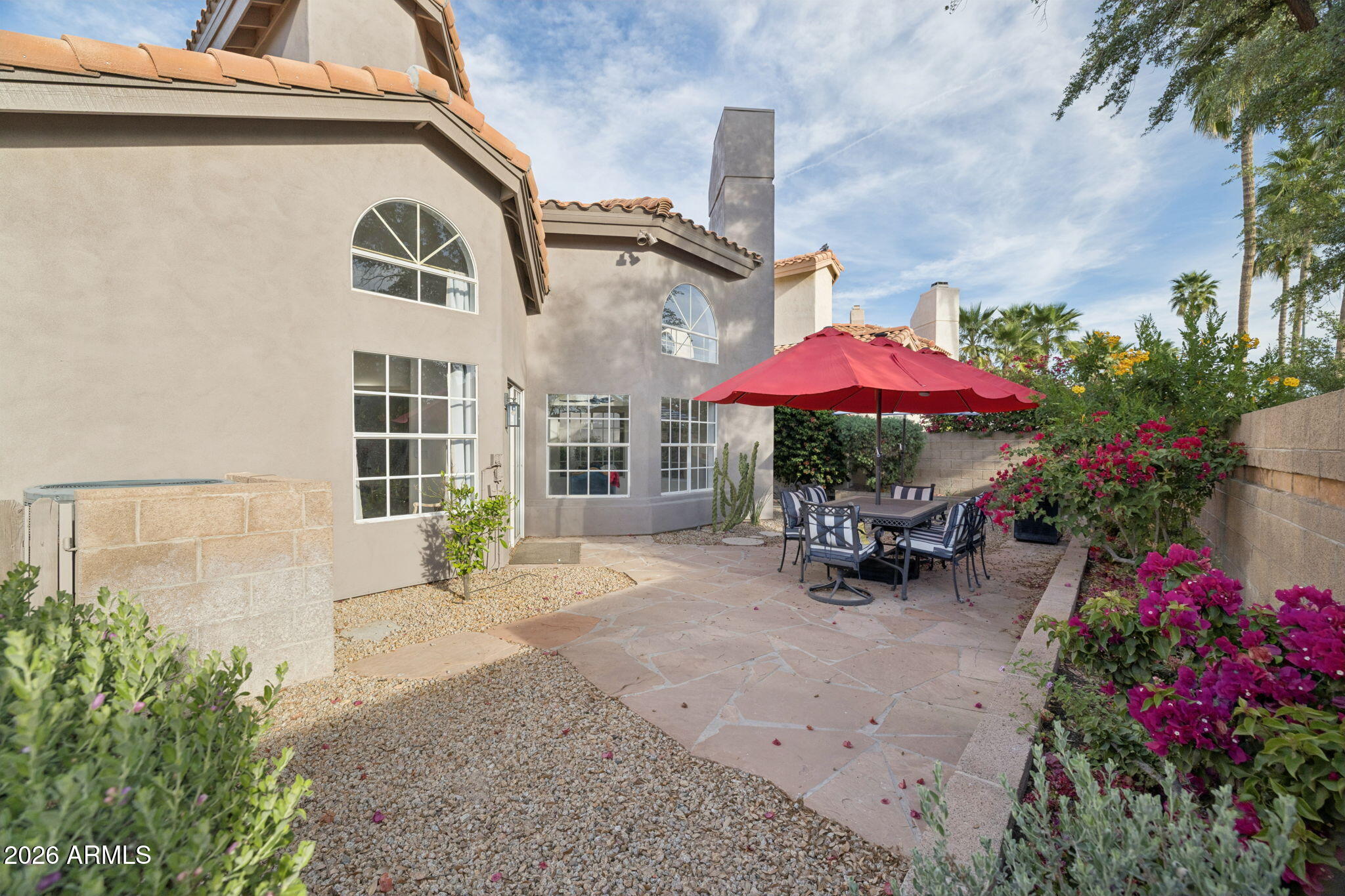 16409 South 33rd Street Phoenix, AZ 85048 - Photo 51 of 61 a view of a patio with a table and chairs under an umbrella